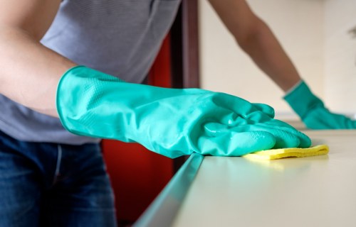 Protective gloves and PPE used during carpet cleaning