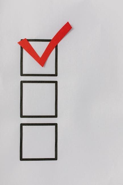 A close-up of a vertical checklist with three empty square boxes drawn with black marker on a white surface. The top box contains a large red checkmark, indicating completion, while the two lower boxes remain empty. The background is plain white, and the entire image emphasizes the concept of task completion, relevant to cleaning checklists and sanitation procedures in residential and commercial environments. This image visually supports surface cleaning, thorough sanitisation, and maintenance tasks, which are key elements in end of tenancy cleaning services provided by Carpet Cleaning E5 on the Clapton Park estate checklist page.